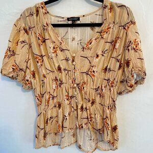 Whimsical buttoned peplum floral blouse in peach!